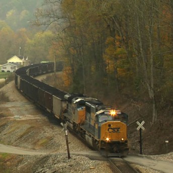 A train arrives at a stop sign.