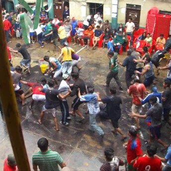 A large group of eople fighting.