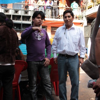 Two men talking in front of the camera.