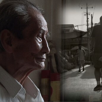 Still from Missing Home: The Last Days of the Beijing Hutongs Weimin Zhang. Close-up of an elderly man looking to the right of the frame where an overlaid black and white image shows a man walking towards a man biking on a street.