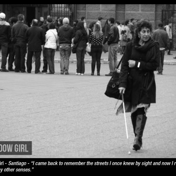 Director María Teresa Larraín walks in a street with a cane. She wears a coat and boots.