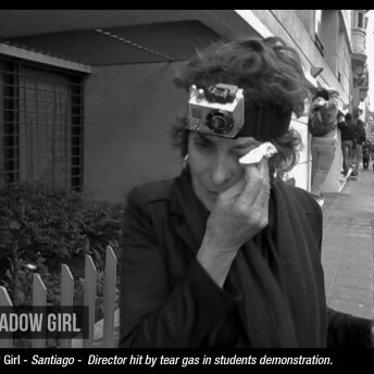 Director María Teresa Larraín cleaning her tearing eyes. She has been hit by tear gas in a student demonstration.