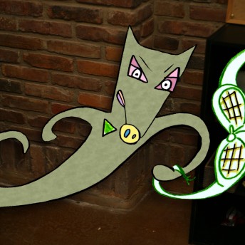 An illustrated grey dog with furrowed eyebrows holding a green object in one hand. The background is a brick wall. Color photograph.