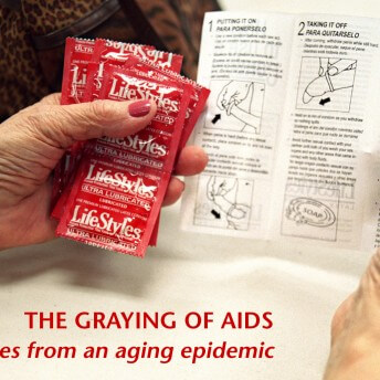 A graphic from The Graying of AIDS. A photo of a person's hands holding a bunch of condoms and a set of instructions for how to put on a condom. Their nails are painted red. There is red text on the bottom of the image that reads, "THE GRAYING OF AIDS stories from an aging epidemic".