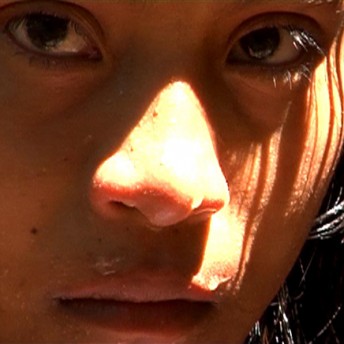 A close-up of a person's face. Color photograph.