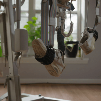 Still from Storming. Machine equipment with tennis shoes on pedals.