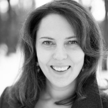 Director Margreth Olin in a coat, background winter landscape in Oslo