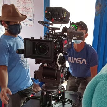 Two men work with a camera