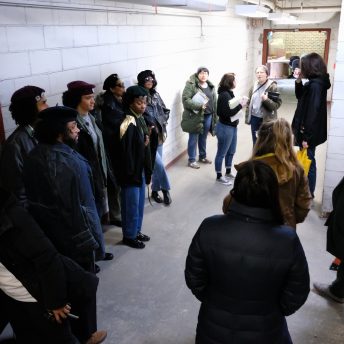 High angle shot of Emma Francis-Snyder giving instructions to a group of actors
