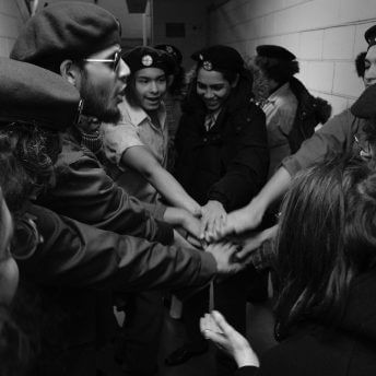 A group of actors holding hands as sign of union