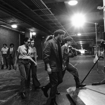 Actors getting inside of the back of a trailer