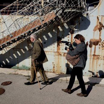 Mila Turajlić and Stevan Labudović visiting the decaying ship of Yugoslav President Tito during filming.