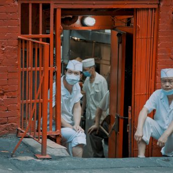 Chefs from New York Chinatown’s Hop Kee Restaurant having a break.