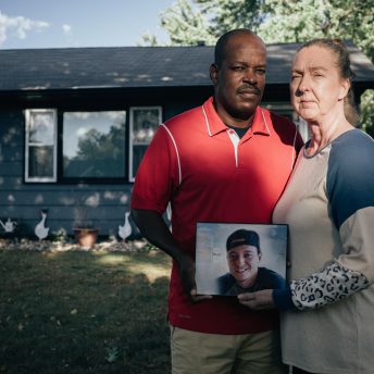 James Holt Jr and Nicole Smith Holt holding a portrait of Alec Smith in memory