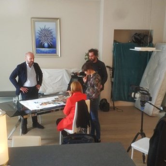 Neil Datta and Maris with crew analyzing the photos of anti-gender movement in Europe.